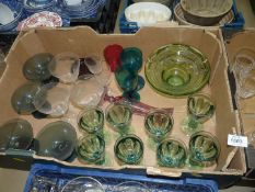 A quantity of old coloured glasses including seven green wine glasses, turquoise g;asses,