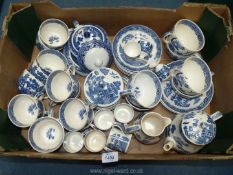 A quantity of Wedgwood 'Willow' pattern tea ware including breakfast and tea cups, coffee cans,
