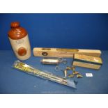 A quantity of miscellanea to include a stoneware hot water bottle, gun cleaning kit,