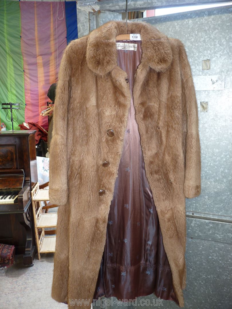 A Musquash Mink Fur Coat with "Furriers of the West" label