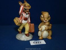 A Royal Doulton 'Father Bunnykins' and Beswick 'Bunny with baby', all in good condition.