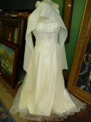 An ''Amanda Wyatt'' wedding Dress with beaded front panelling and zip/button back,