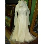 An ''Amanda Wyatt'' wedding Dress with beaded front panelling and zip/button back,