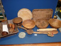 A quantity of Treen including bread board, rolling pin, cutlery tray, wooden bowls,
