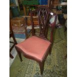 An elegant Mahogany framed side Chair having a scroll/lattice splat,