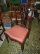 An elegant Mahogany framed side Chair having a scroll/lattice splat,