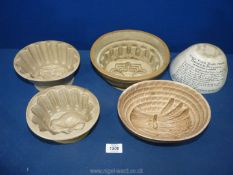 Five large Ironstone jelly moulds decorated with wheat sheaves, partridge, etc.