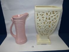 A decorative cream pierced Vase, 13'' tall and a pink jug, 11'' tall.