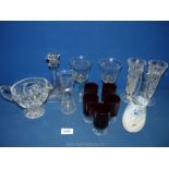 A small quantity of glass to include five cranberry sherry glasses, bud vases, two glass goblets,