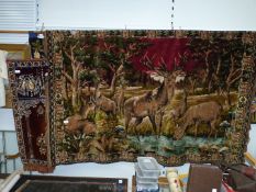 A large velvet wall tapestry of deer and stag by water, 6' x 47", plus a smaller wall tapestry.