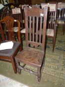 A primitive peg-joyned Oak hall/side Chair having a solid seat,