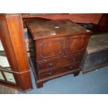 A circa 1800 Mahogany Commode having two false drawers to the front,