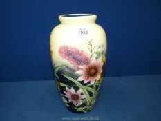 A Tupton ware vase in Moorcroft style floral pattern, 11 1/4" tall.