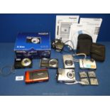 A quantity of digital cameras to include a boxed Olympus X-915 camera,