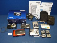 A quantity of digital cameras to include a boxed Olympus X-915 camera,