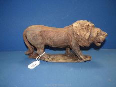 A good quality hand carved Ironwood lion, 12½'' long, 6½'' high, 1.7 kg approx.