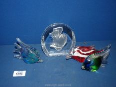 Three glass fish figures and daisy duck paperweight.
