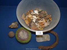 A quantity of archeological finds including remnants of clay pipes, iron horseshoes,