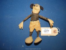 An early Mickey Mouse soft toy with black cloth body, felt hands and ears with flat leather feet,