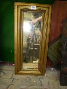 A rectangular gilt framed mirror,