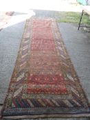 A Harvey Nichols of Knightsbridge carpet runner, rust ground,