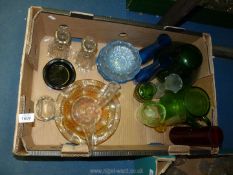 A quantity of coloured and clear glass including vases, candlesticks, dessert dishes etc.