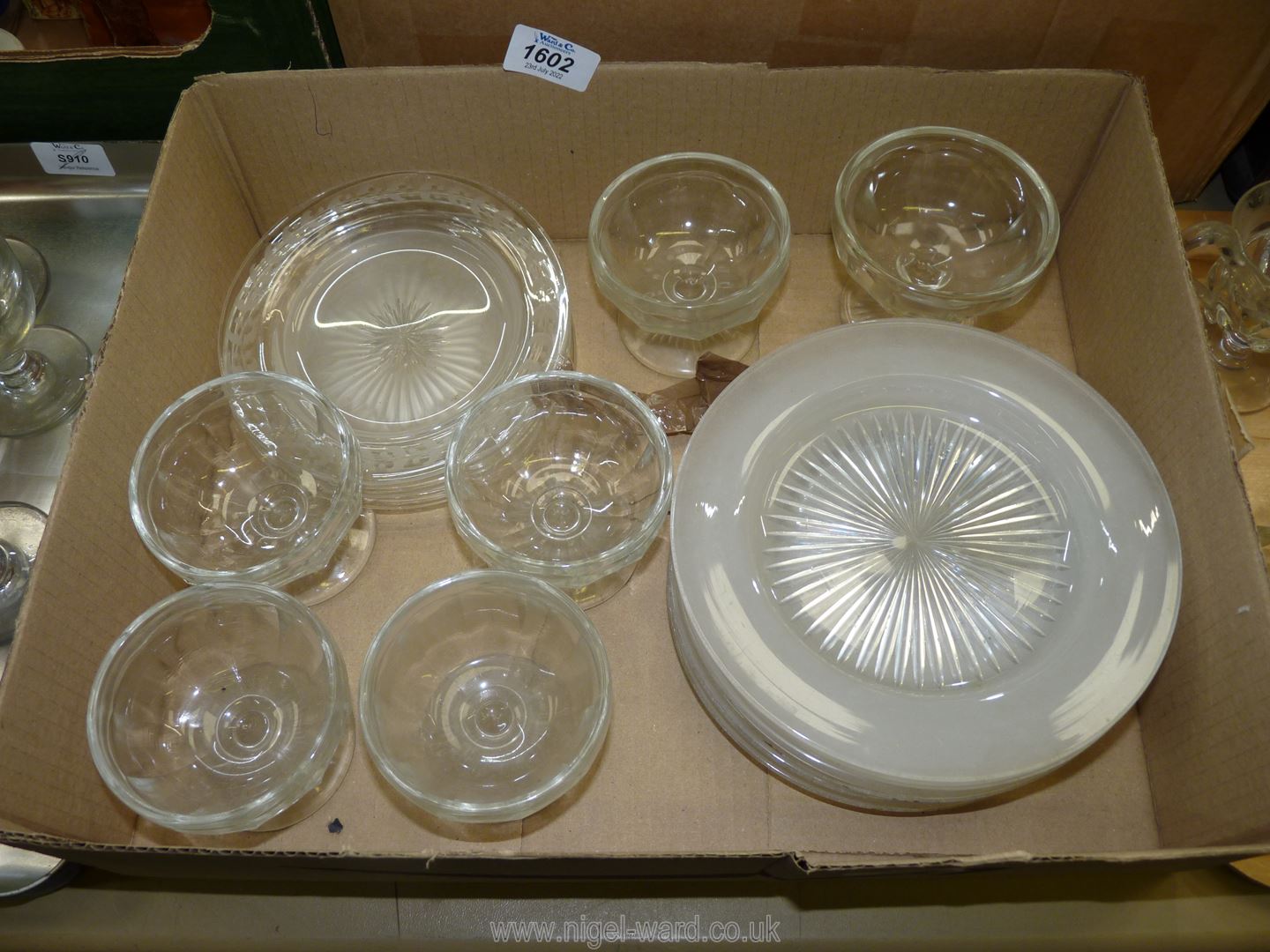 Six old pressed glass grapefruit dishes and a small quantity of frosted glass dessert dishes.