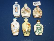 Six Oriental porcelain scent bottles, some with character marks to base.