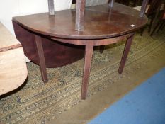 A most unusual and surprisingly heavy Mahogany demi-lune side Table with a rear hinged drop-leaf