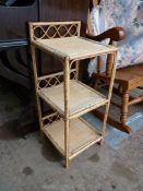 A three tier cane and bamboo Etagere, 11 3/4'' x 12'' x 28'' high approx.