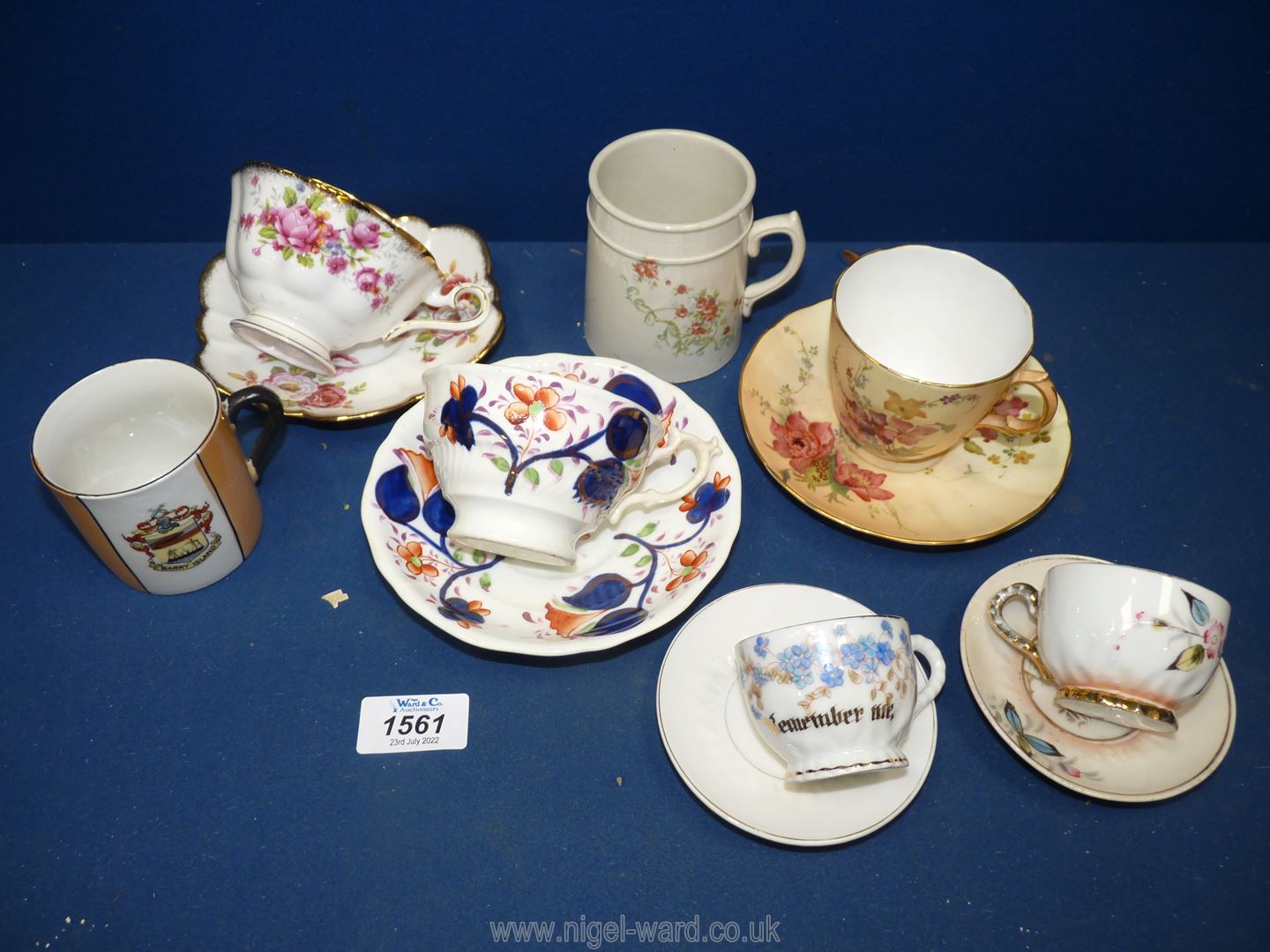 A Royal Worcester cup and saucer (chip to cup) plus a Royal Albert cup and saucer,