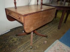 A circa 1900 Mahogany dropleaf Table having a drawer to one end,