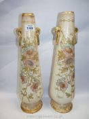 A pair of tall ceramic vases, cream and gold with floral relief, circa 1890, 17" tall.