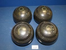 A set of four Henselite lawn bowls, size 5.