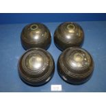 A set of four Henselite lawn bowls, size 5.