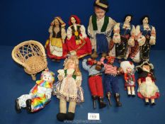 A Dolls of the World Collection including cloth faces and bodies, pirates, nautical costume,