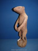 A large hand carved Ironwood Meerkat, carved from one piece of tree, standing at 18½'',
