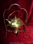 A brass kettle on stand.