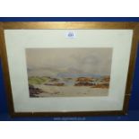 A framed and mounted watercolour depicting a coastal scene, signed lower right H.