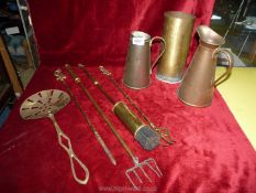 A small quantity of brass and copper items to include; jugs, toasting forks, etc.