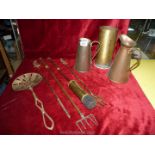 A small quantity of brass and copper items to include; jugs, toasting forks, etc.