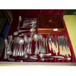 A quantity of epns and plated cutlery to include knives and forks with twist bone handles, spoons,