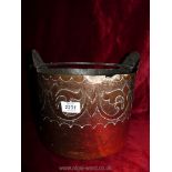 A copper coal bucket with straight sides and embossed detail, 10½" diameter x 10" high.