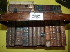 A wooden trough of books to include; The Poetical Works of John Milton,