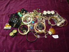 A pink box of costume jewellery including bangles, collar, earrings etc.