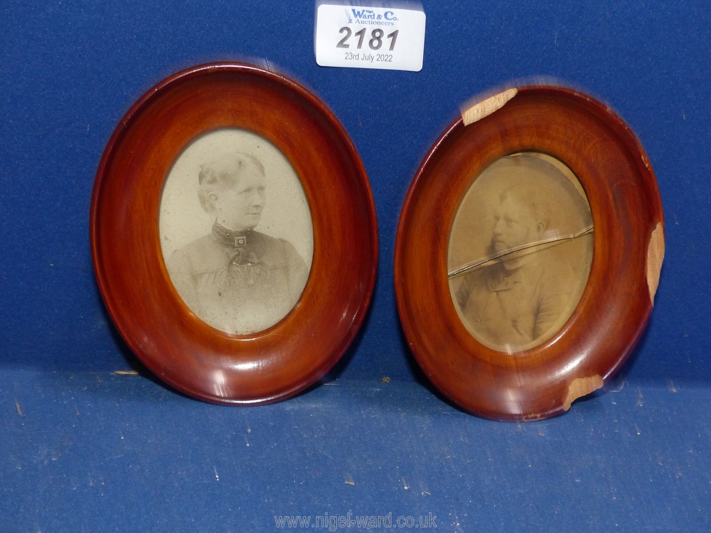 A pair of oval believed cherry wood framed sepia photographic Portraits of a bearded gentleman and