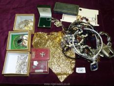 A drawer of costume jewellery including bracelets, beads, scarf clips etc.