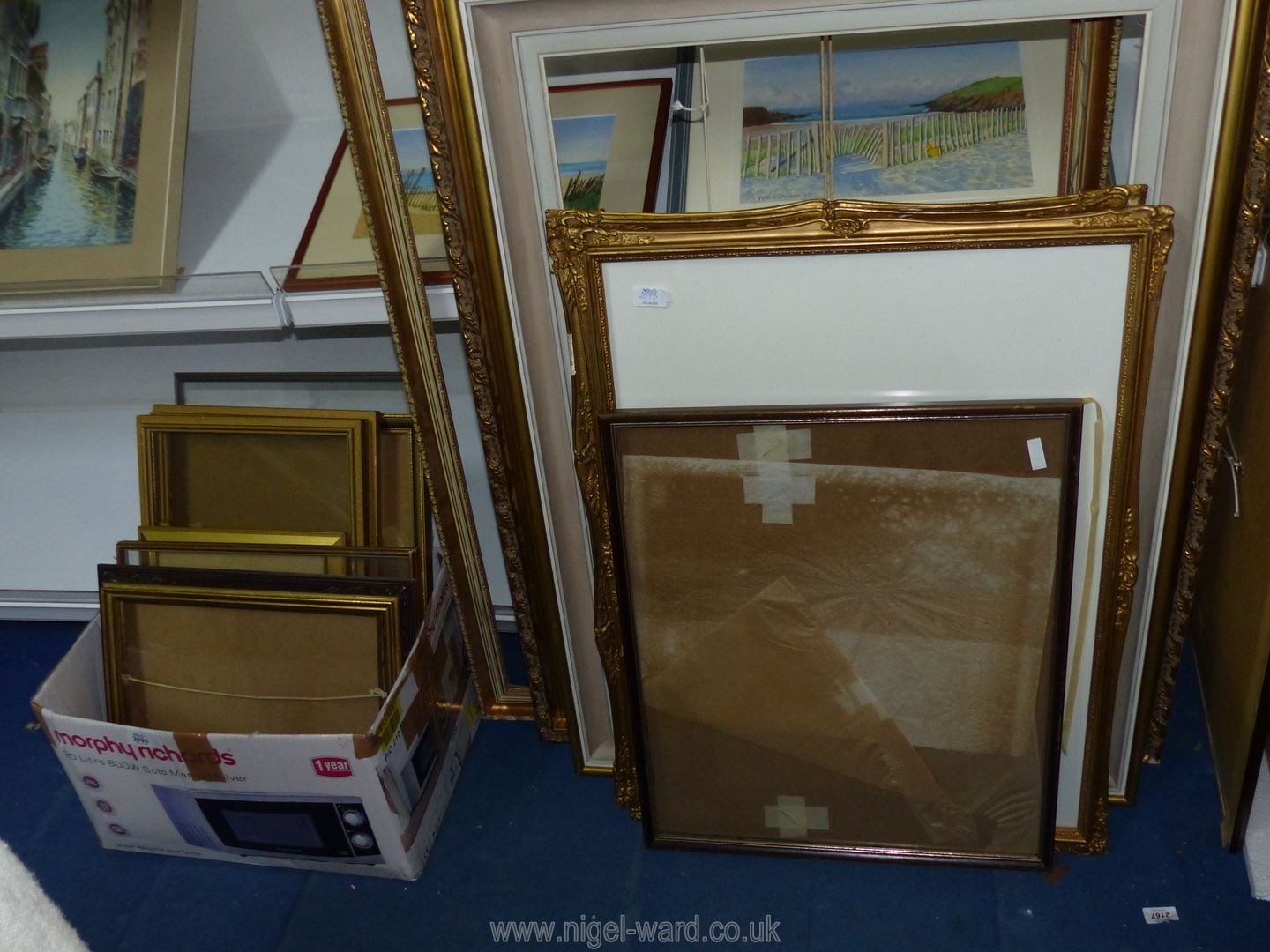 A quantity of picture frames.