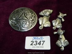 A Past Times pewter Celtic swirl brooch inspired by the Book of Kells,