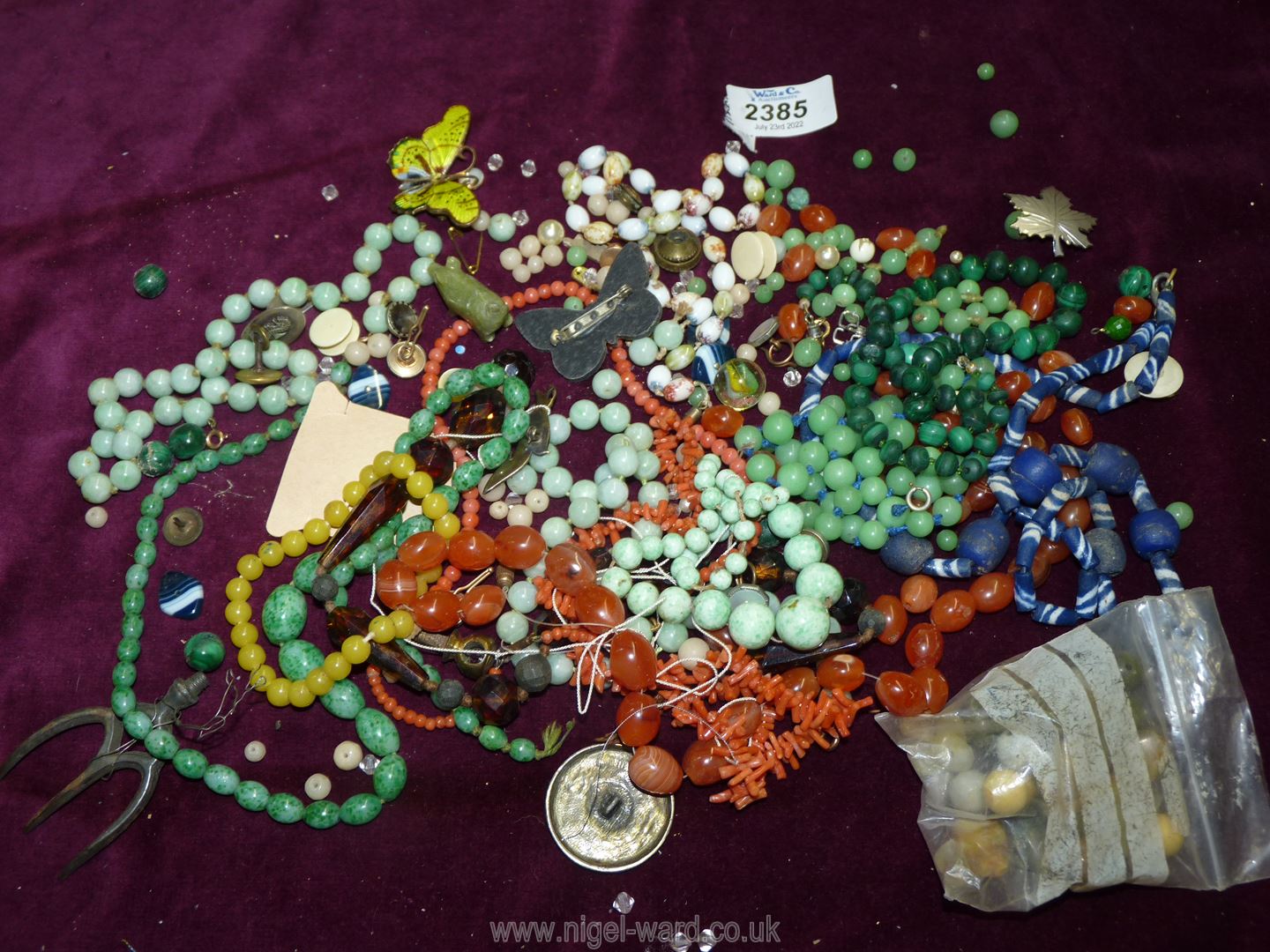 A quantity of jewellery including coral necklace, silver bird brooch,